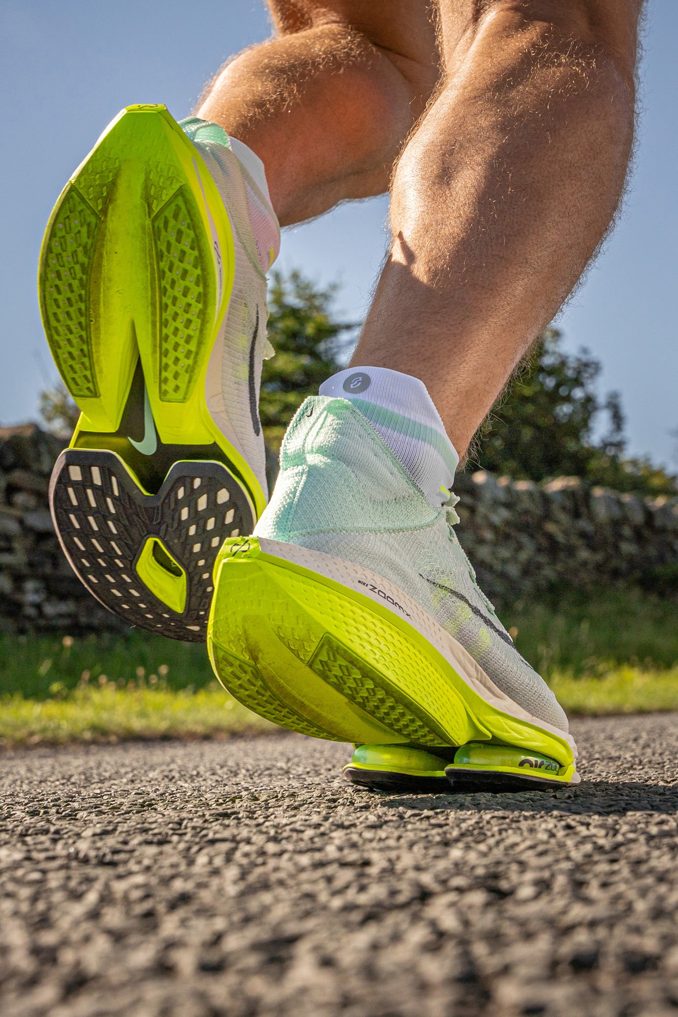 Nike mint running socks on runner